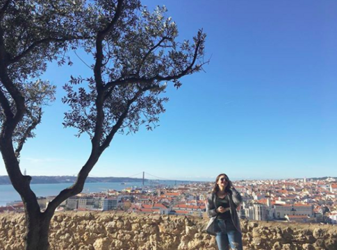 Female student in front of city view - Lisbon, Portugal