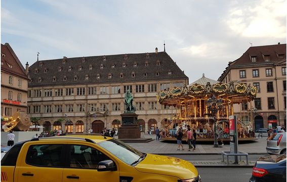 Streets of Strasbourg in the evening and a carousel