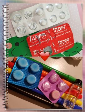Pictures of different medicines on a writing pad