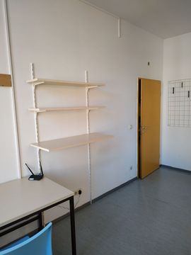 Empty shelf in an empty room