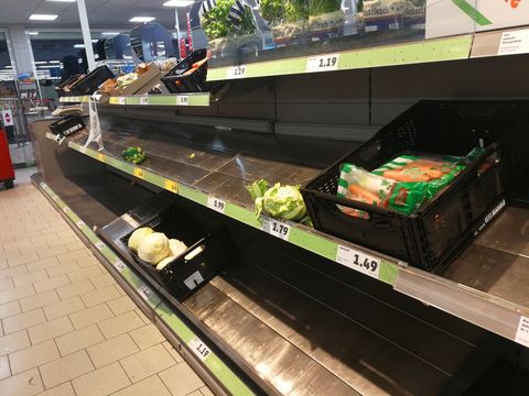 Nearly empty supermarket shelves.