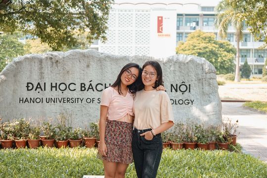 Anh-Hoang and her friend smile at the camera