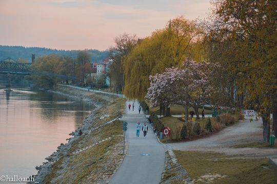 A river and its promenade during sunset
