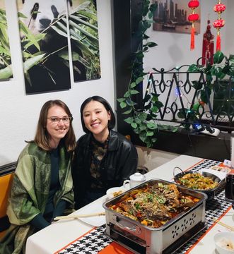 Jinmeng with friend Janina in a Chinese restaurant