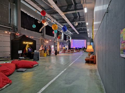 The industrial-style halls where the film festival takes place. There is a stage with a screen for discussions and master classes, but there are also opportunities to retreat and have conversations.