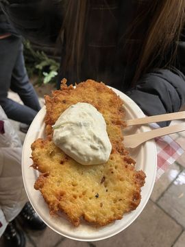 Reibekuchen, a German food made from grated potatoes fried in fat.