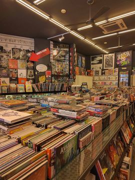 Old books and vinyls at a vintage music shop