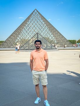 Umar in front of Louvre Museum