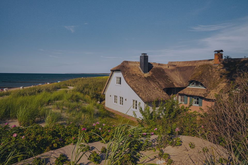 View of a thatched house on the beach
