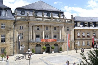 The Opera House in Bayreuth, with passersby and students in the foreground, is a UNESCO World Heritage Site.