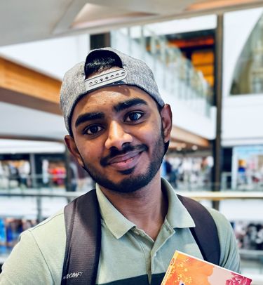 Blogger Abhishek smiling into camera.